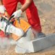 Construction,Worker,At,Curb,Stone,Cutting,Work,By,Cut-off,Saw